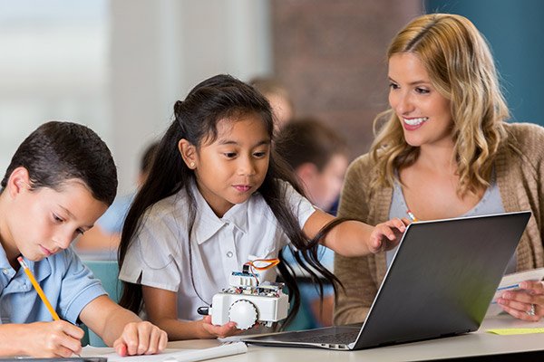 Teacher And Pupils In Classroom